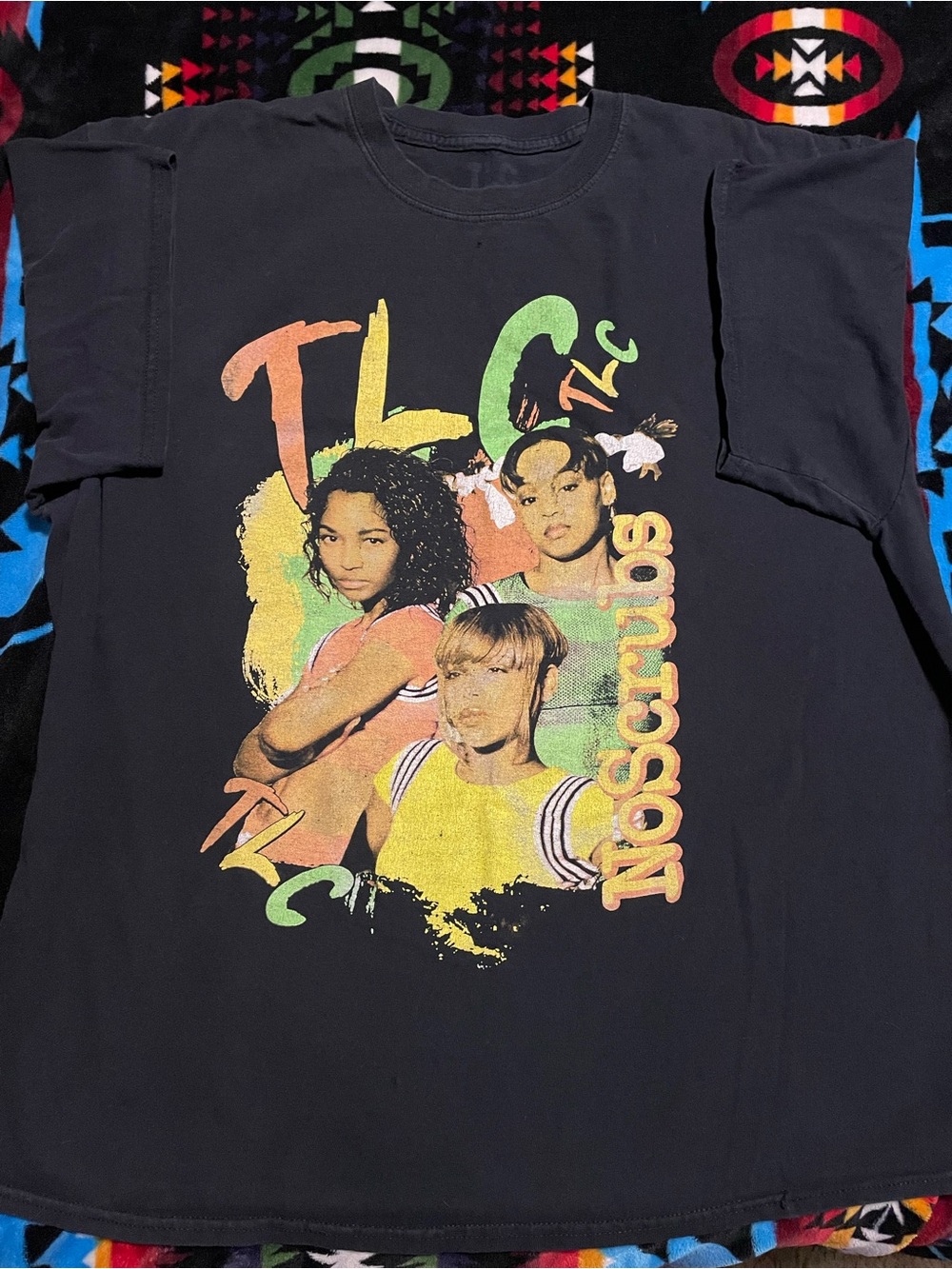 TLC Vintage-Style Black Graphic Tee with Neon Band Art